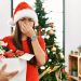 Woman holding her nose because of smelly Christmas tree